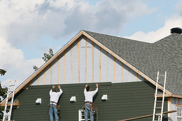 Professional Siding technician working in Covesville, VA